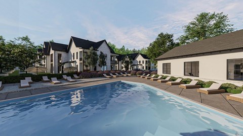 A swimming pool in front of a row of houses.